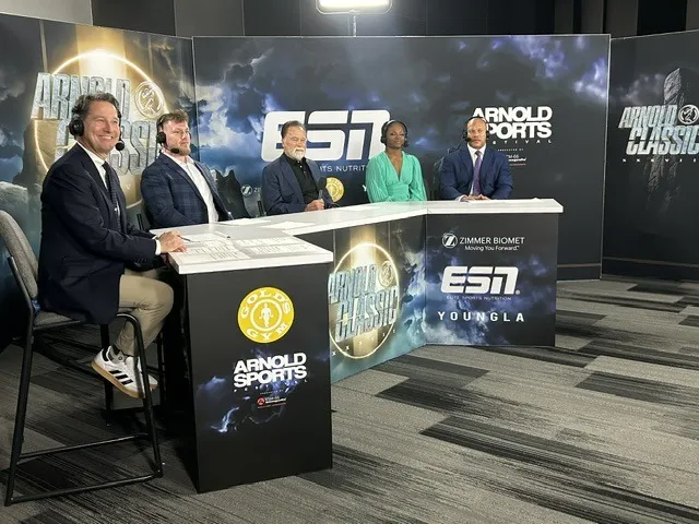 Todd Harris on the ESPN desk at the Arnold Sports Festival with four co-hosts.