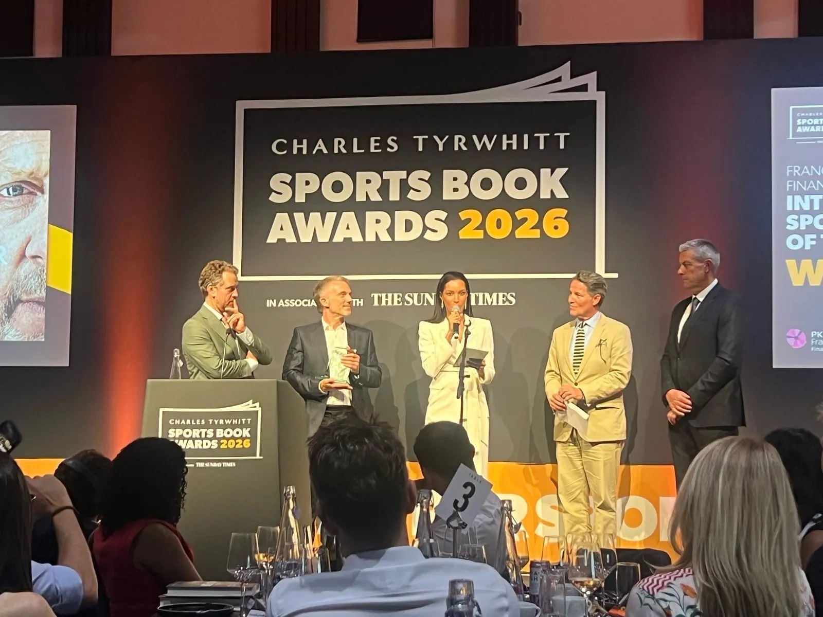 Todd Harris on stage at the 2026 Sports Book Awards in London.